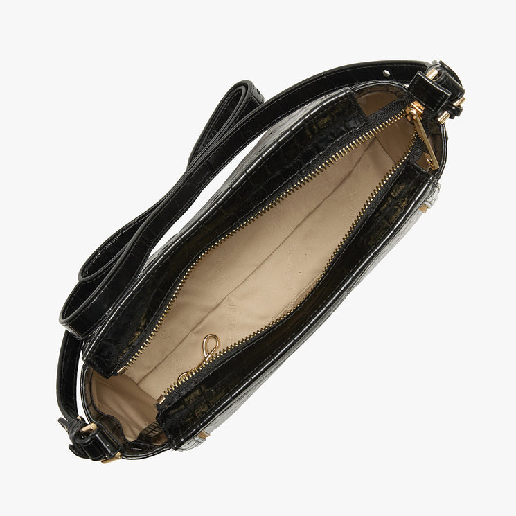 Black crocodile-embossed leather crossbody bag shown open, displaying a beige interior lining and gold-tone hardware, set against a plain light gray background.