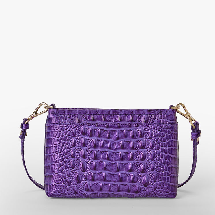 Brahmin small purple handbag with gold hardware, embossed crocodile-inspired texture, detachable shoulder strap, structured silhouette. Bag displayed against a plain white background for clear product detail.