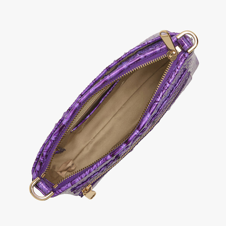 Top view of an open Brahmin purple textured handbag with beige lining, zip pocket, gold zipper and hardware on both ends. The structured silhouette is empty and displayed on a white background.