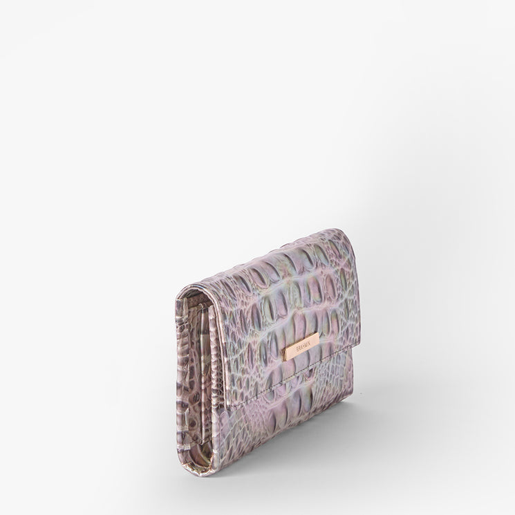 Brahmin clutch in a small rectangular silhouette, featuring a pink and grey textured pattern, gold-tone front nameplate hardware, no visible strap, shown on a plain white background.