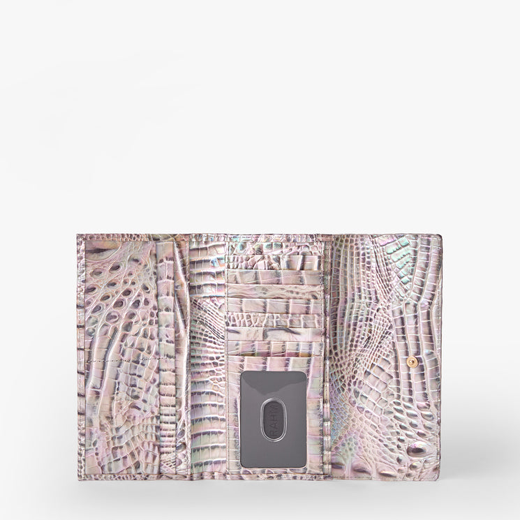 Brahmin pastel wallet with embossed pattern, open to show multiple card slots, gold-tone metal clip, and snap button closure; displayed against a white background.