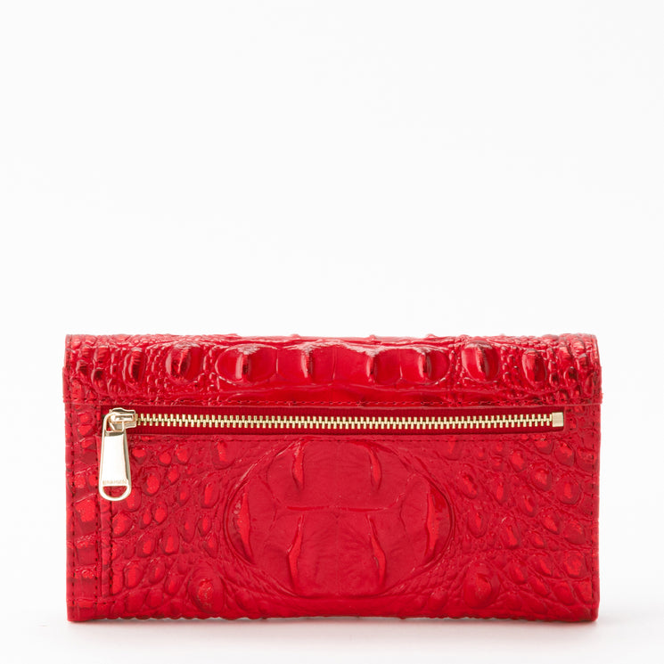 Brahmin Cordelia Wallet in holiday red with a glossy, textured embossed pattern, featuring a back flap with a gold-tone exterior zipper.