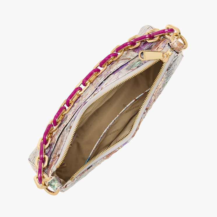 Brahmin shoulder bag with gold and pink chain strap, textured multicolored exterior, and structured silhouette. Bag is open to show beige interior with compartments and a zippered pocket.