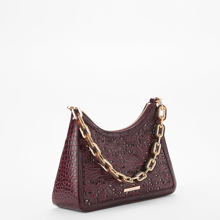 A burgundy embossed leather shoulder bag with a gold chain strap, shown on a clean white background.