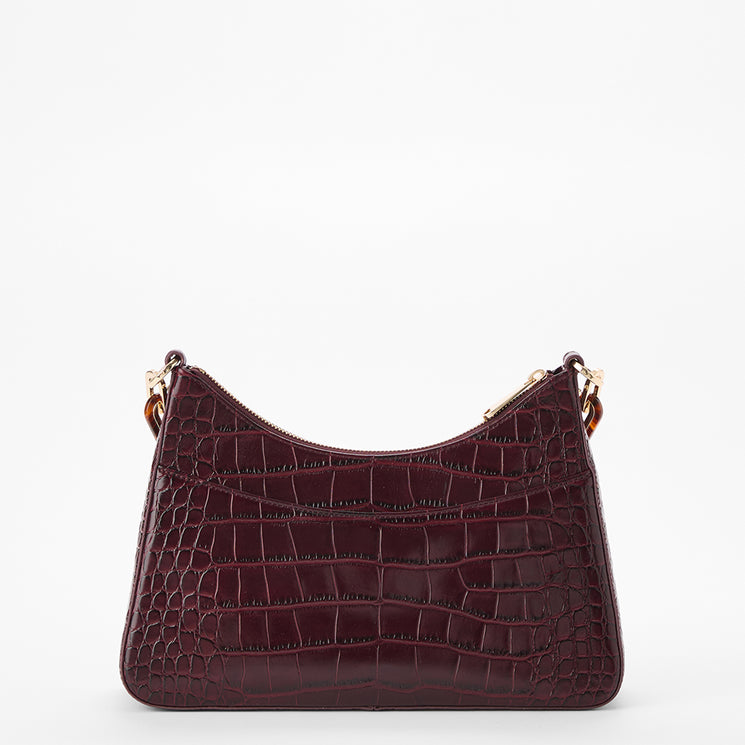 A burgundy crocodile-embossed leather shoulder bag with gold-tone hardware, photographed against a seamless white background.