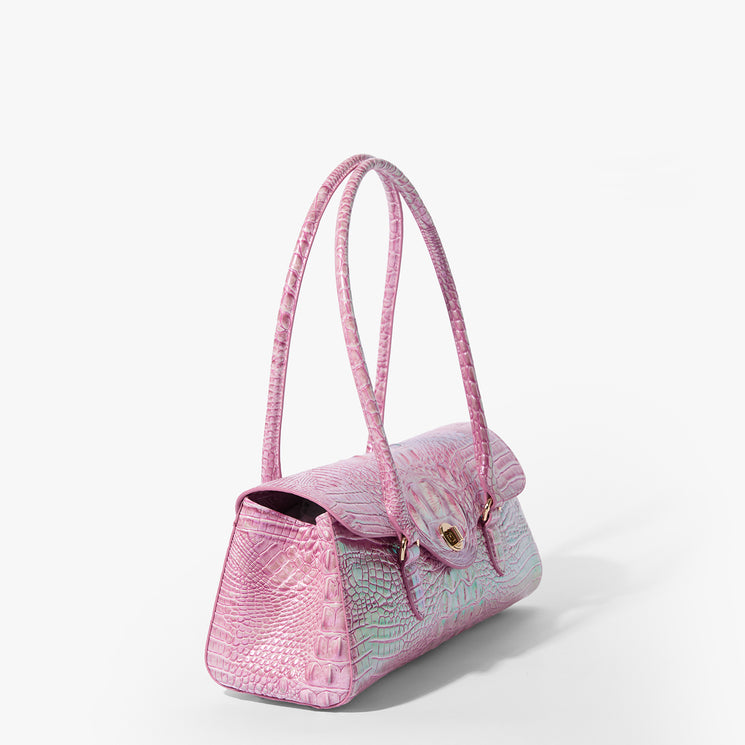 Brahmin structured handbag in pink embossed leather with two long shoulder straps and a gold-tone clasp, shown angled on a white background to display its side silhouette and top.