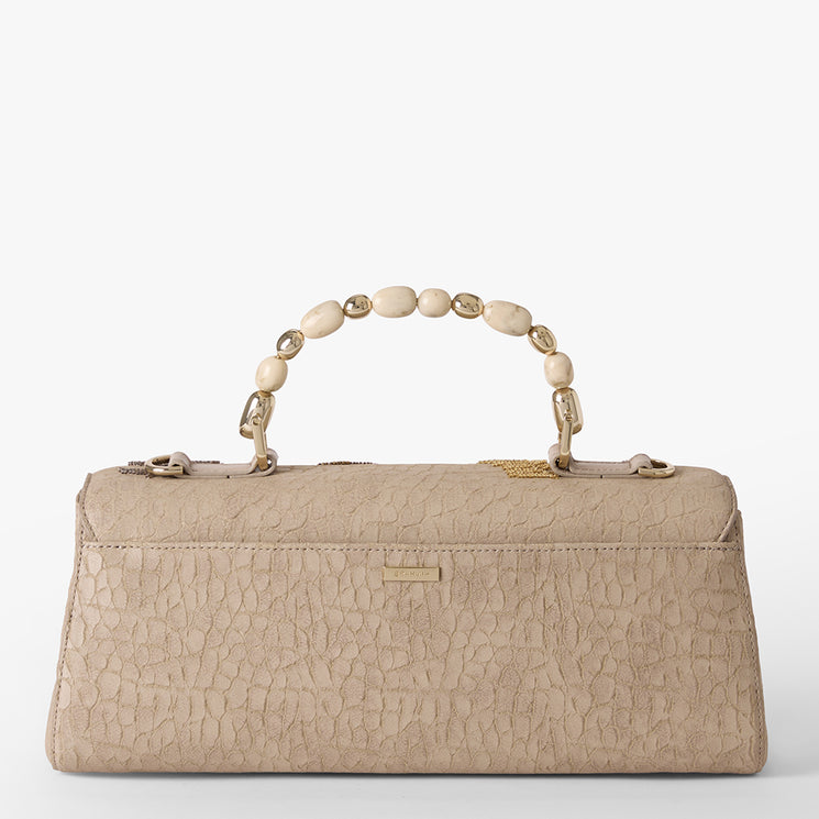 Beige handbag with butterfly and fern embroidery on a white background. Dayan back view.
