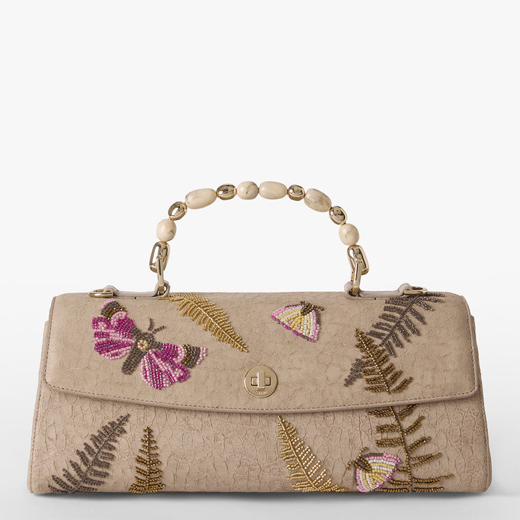 Beige handbag with butterfly and fern embroidery on a white background. Dayan front view.