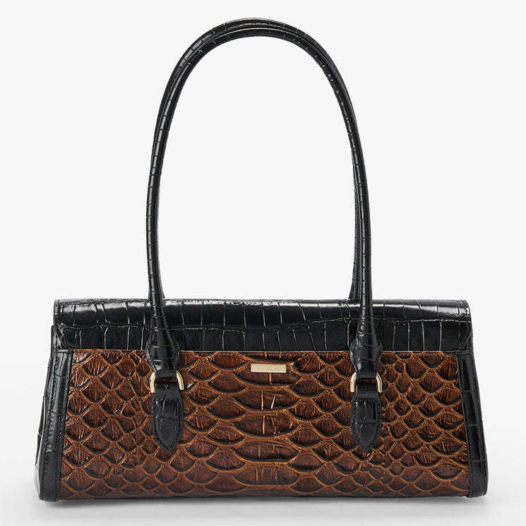 A structured handbag with a brown and black crocodile-embossed pattern, featuring dual top handles and a small gold-tone metal accent on the front, set against a plain light gray background.