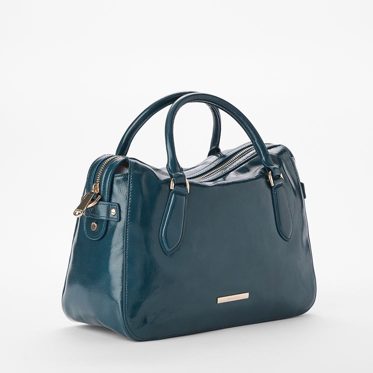 Brahmin teal leather handbag with gold hardware, zip closure, and two short handles in a structured silhouette. Features smooth texture and sits on a plain white background, front view displayed.