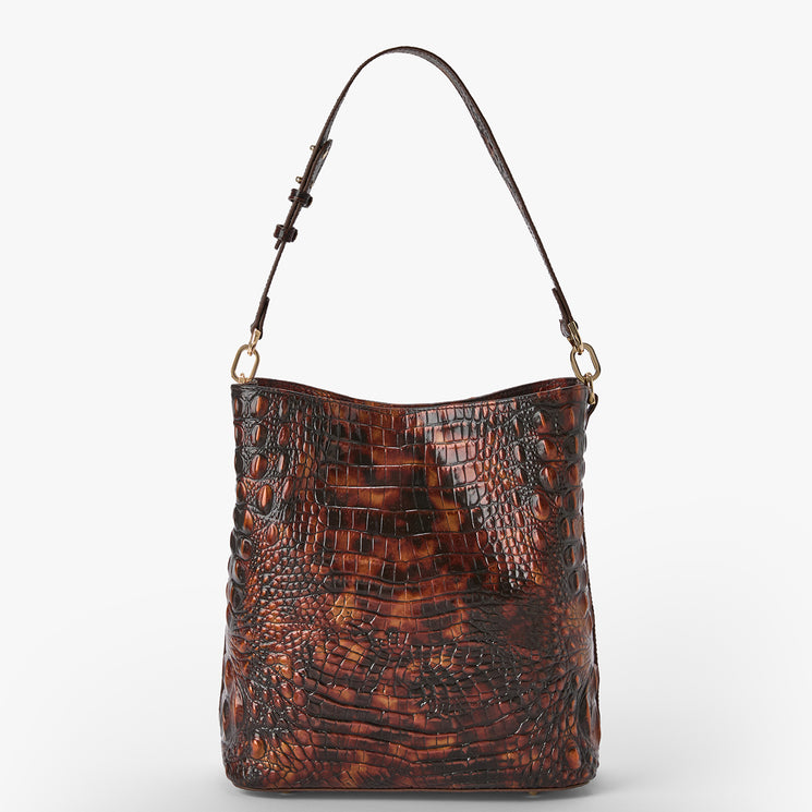 A brown crocodile-embossed leather shoulder bag with a single adjustable strap and gold-tone hardware, shown against a plain light gray background.