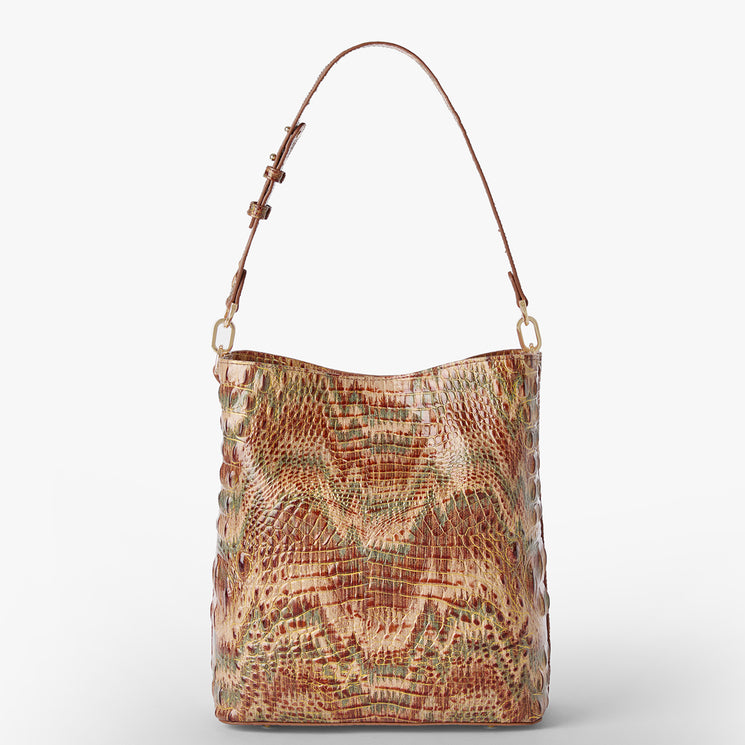 A shoulder bag with a textured crocodile skin pattern in shades of brown, beige, and muted green, featuring a gold Brahmin plaque on the front. Celina Back View.