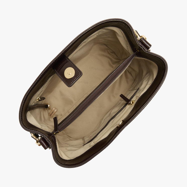 An overhead view of a dark brown leather handbag showing its beige interior lining, zippered compartments, and gold-tone hardware against a light gray background.