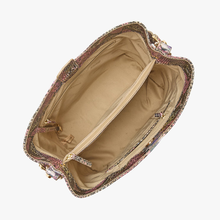 Brahmin satchel with multicolored trim, shown open to display a beige fabric-lined interior with central zippered pocket, side slip pockets, and gold-tone hardware accents along the edges.