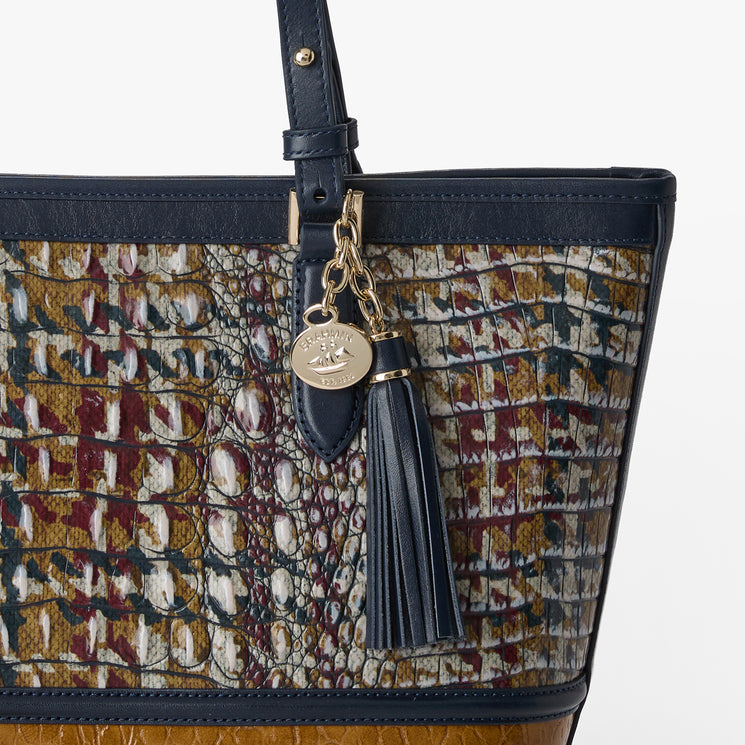 Multicolored patterned Medium Asher handbag with brown accents on a white background. Close up view.