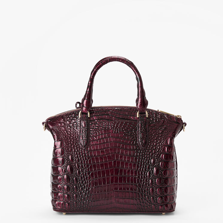 A structured handbag with a glossy crocodile-embossed texture in deep burgundy, featuring dual top handles and gold-tone hardware, set against a plain white background. Back view.