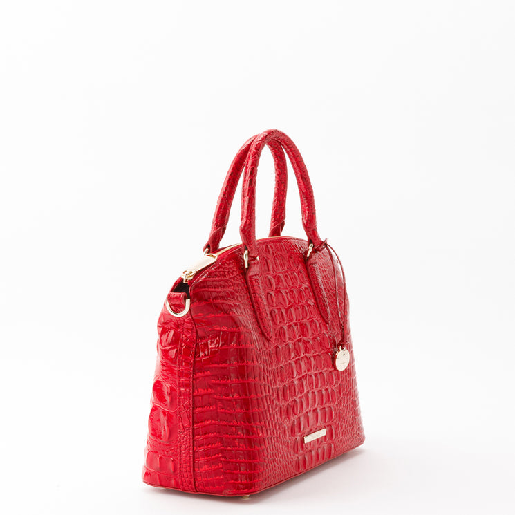 Brahmin Duxbury Satchel in bright red with a glossy, croc-embossed texture. Features gold-tone hardware, dual top handles, and a zip-top closure.