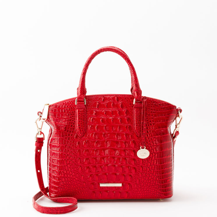 Red Brahmin Duxbury Satchel featuring a glossy, textured embossed finish, dual top handles, a detachable shoulder strap, and gold-tone hardware.