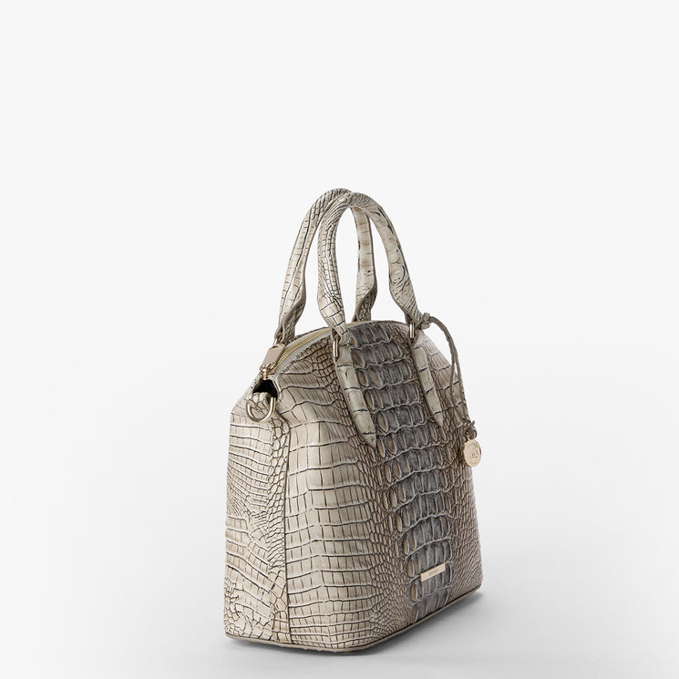 Beige crocodile-patterned Duxbury Satchel handbag on a white background. Side view.