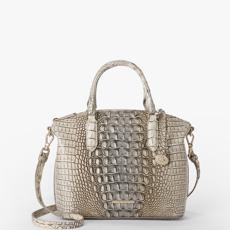Beige crocodile-patterned Duxbury Satchel handbag on a white background. Front view with strap.