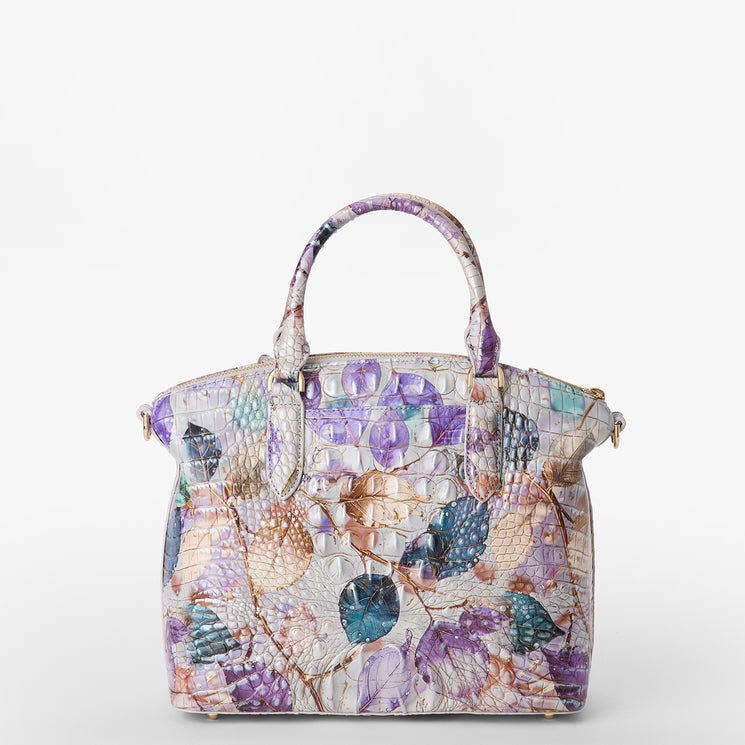 Brahmin structured handbag with two top handles, featuring a textured, multicolored embossed pattern in purple, teal, beige, and ivory hues. Shown on a white background.