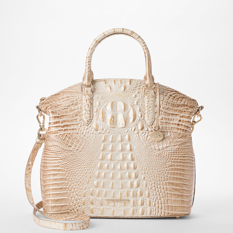 A structured Large Duxbury handbag in textured crocodile-embossed leather, featuring dual top handles and a circular embossed logo on the front, shown against a plain white background. Front view with strap.