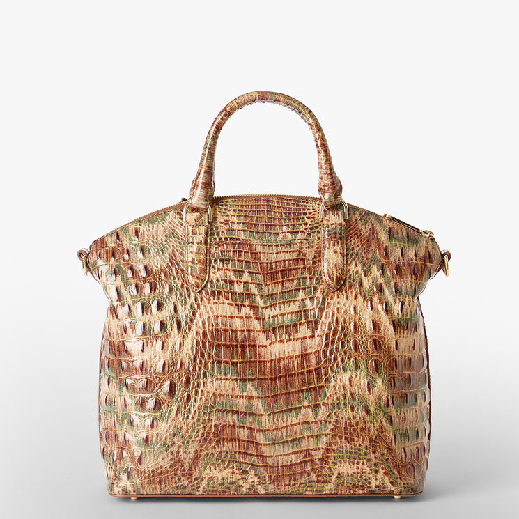 A structured handbag with a crocodile-embossed texture in earthy brown, beige, and muted green tones, featuring dual top handles and a gold Brahmin logo plaque. Large Duxbury Satchel Back View.