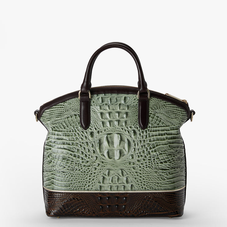 A structured handbag featuring a sage green crocodile-embossed front panel and dark brown faux-crocodile textured trim on the base and handles, shown against a plain white background.