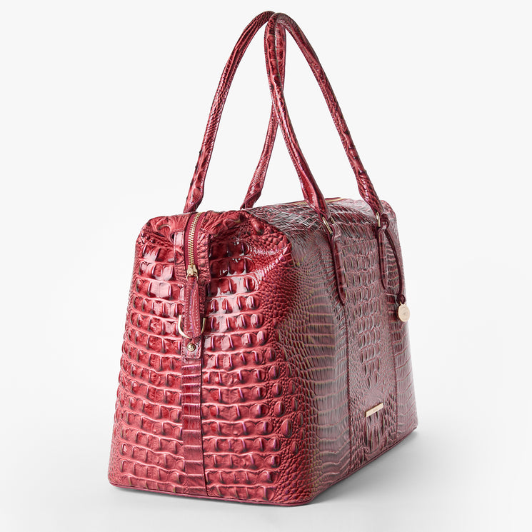 Brahmin red textured leather handbag featuring an embossed pattern, two top handles, gold-tone hardware, structured silhouette, and shown at a three-quarter angle against a white background.