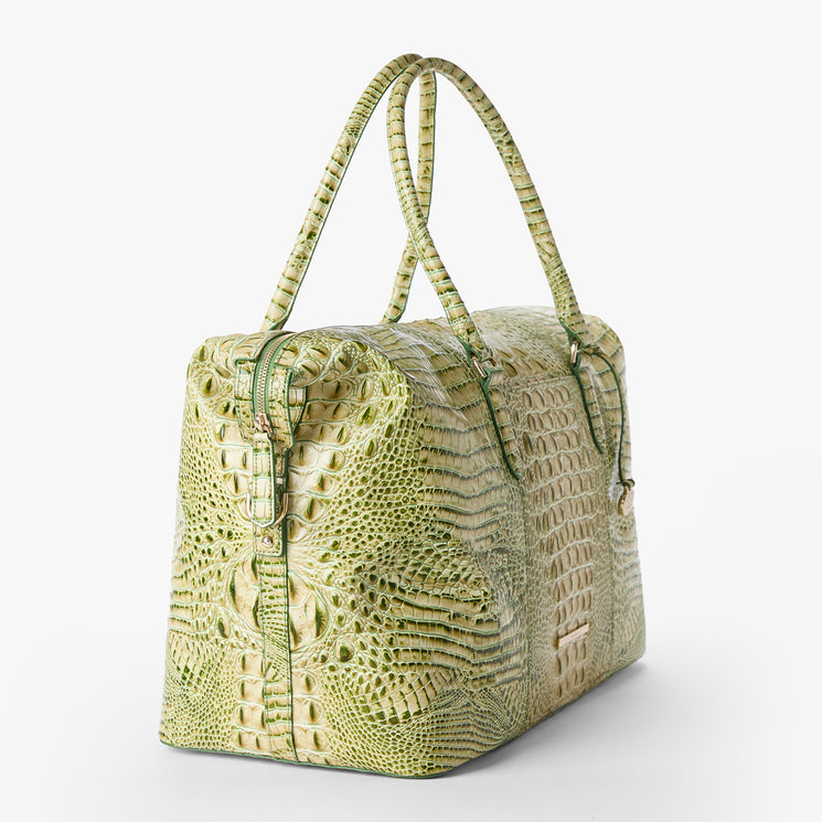 Brahmin light green embossed handbag with rectangular silhouette, double top handles, rich textured pattern, metallic hardware accents, and structured shape. Shown on white background.
