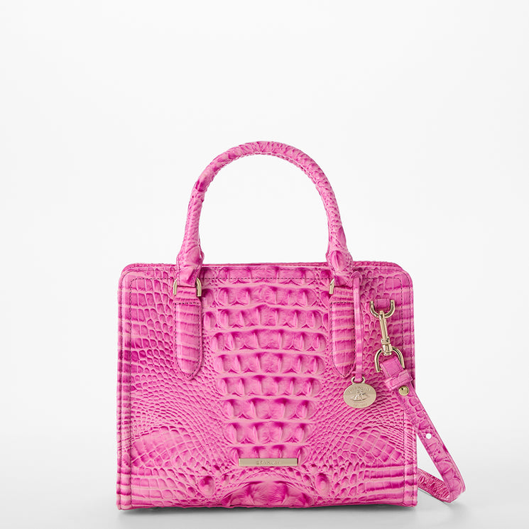 Pink textured Cami handbag with a strap on a light gray background front view