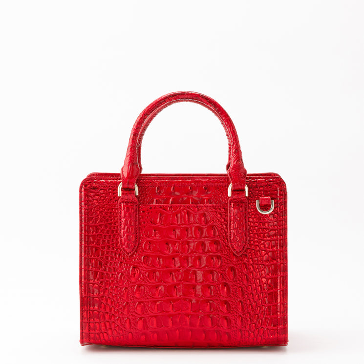 Bright red BRAHMIN Cami satchel in a rectangular silhouette with a glossy, croc-embossed texture, two top handles, and silver-tone hardware.