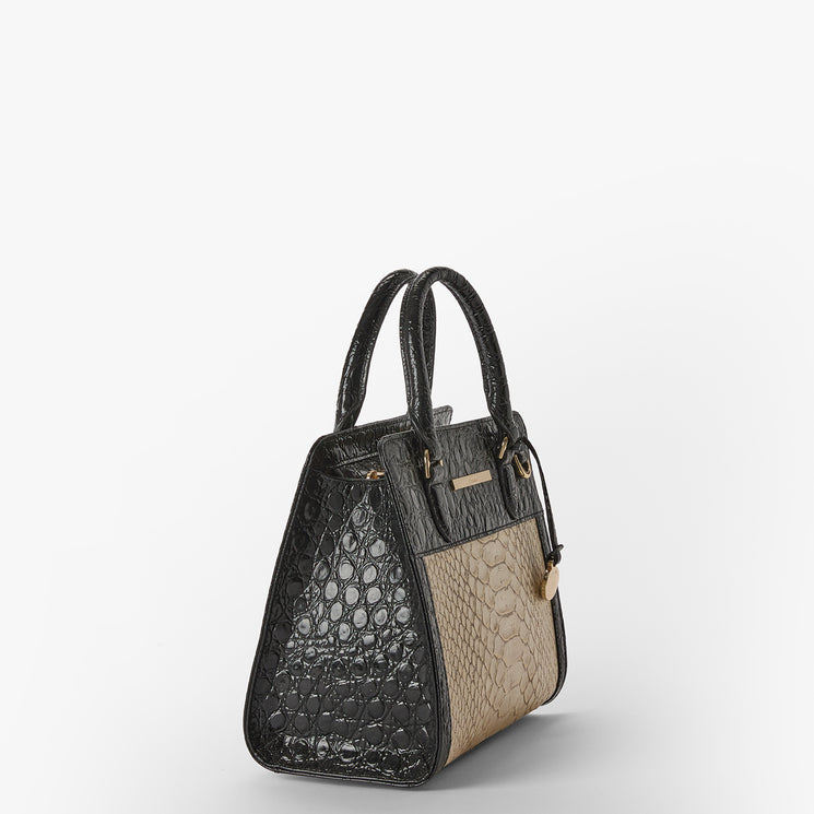 Handbag with black and beige croc pattern on a white background. Cami side view.