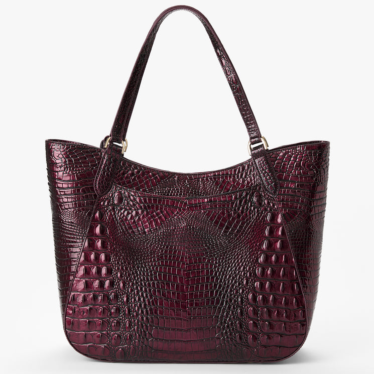 A dark burgundy crocodile-embossed leather tote bag with double shoulder straps and gold-tone hardware, shown against a plain white background. Back view.