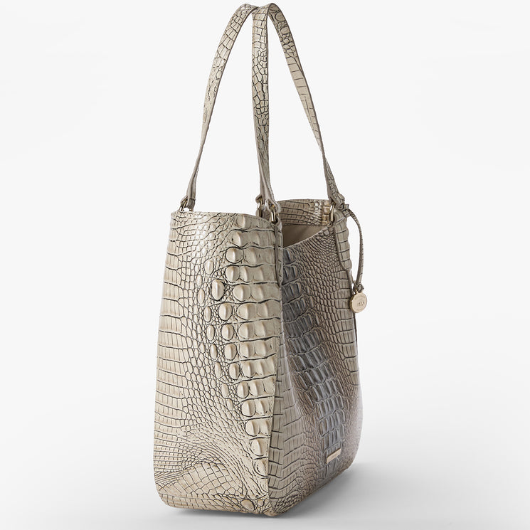 Silver crocodile-patterned Aliza handbag on a white background. Side view.