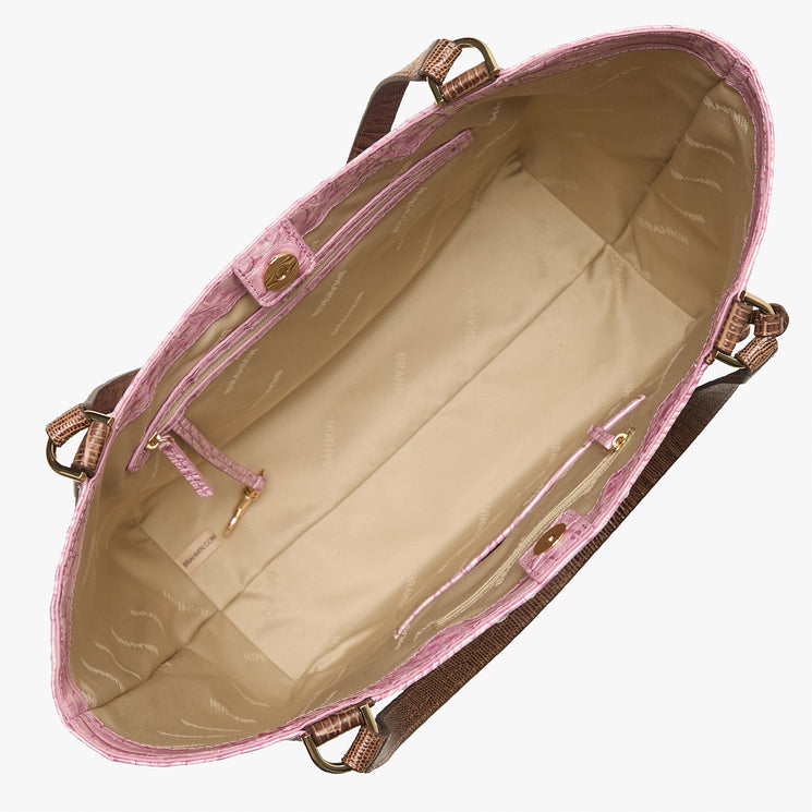Brahmin tote bag in beige with pink trim, top view, showing interior lining, zippered and open pockets, key holder, brown shoulder handles, and gold-tone hardware. Structured silhouette designed for shoulder carry.