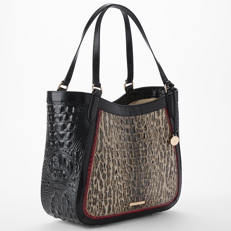 Brahmin handbag with leopard print and black and red leather accents on a white background. Aliza side view.