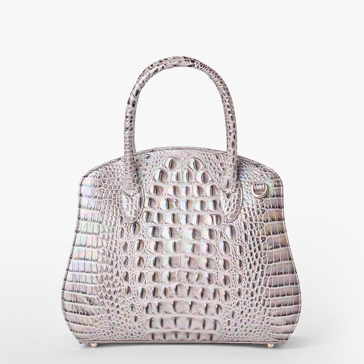 Brahmin structured handbag in light gray with two top handles, shiny crocodile-embossed texture, metallic feet at the base, and a rectangular silhouette, shown against a plain white background.