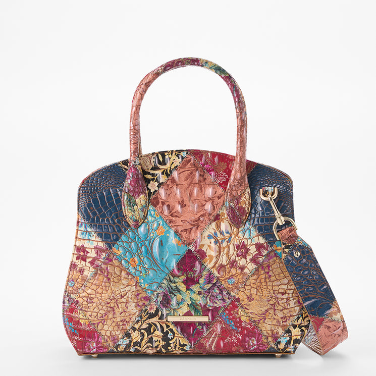 Brahmin patchwork satchel with dual top handles and detachable shoulder strap, shown in multicolor textured panels with floral, embossed reptile-inspired, and geometric patterns against a white background.