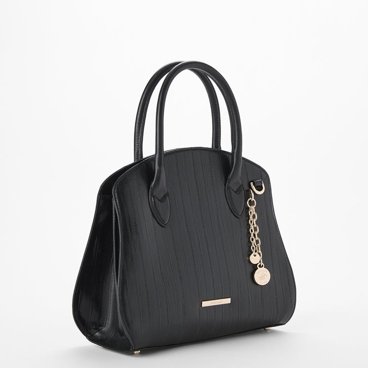 Brahmin black handbag with structured silhouette, double top handles, gold-tone hardware, and gold keychain accents. Bag shown on a plain white background; texture and interior details not visible.