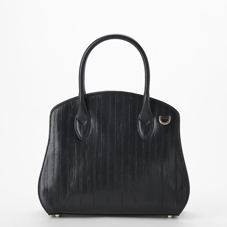 Brahmin black handbag with two top handles, structured curved silhouette, subtle vertical textured finish, and small gold-tone ring accent on upper right. Displayed against a white background.
