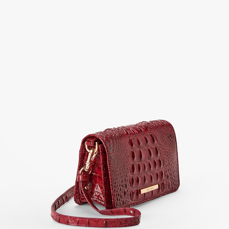 Volcanic Red Melbourne croc textured handbag on a light gray background. Minuette side view.