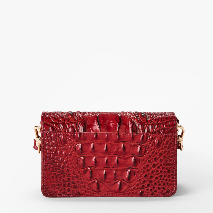Volcanic Red Melbourne croc textured handbag on a light gray background. Minuette back view.