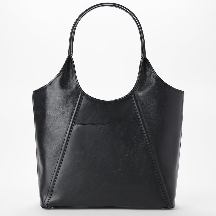 Brahmin black tote bag featuring a spacious silhouette, single rounded handle, angular stitched pattern, front slip pocket, and subtle texturing, shown upright against a plain white background.