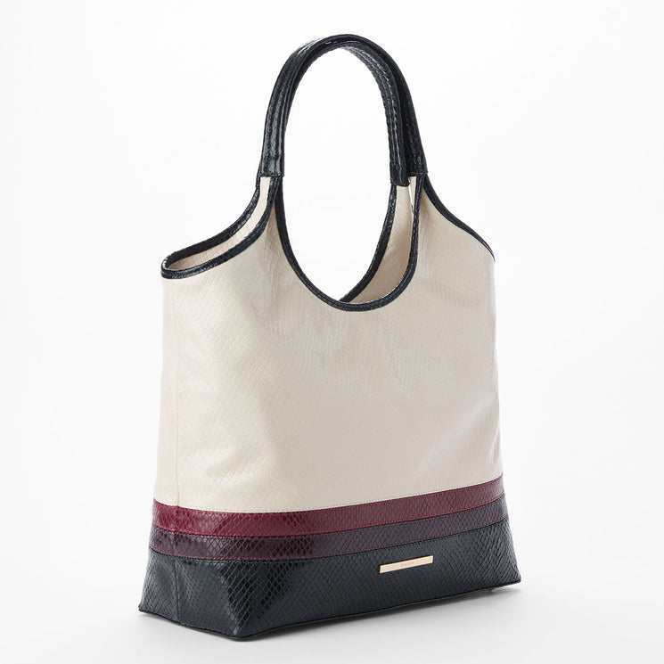 Cream Iona tote bag with black and red accents on a white background. Side view.