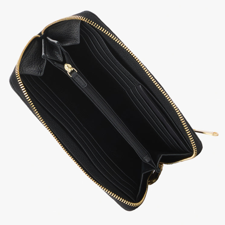 Brahmin black zip-around wallet open to display organized card slots, a central gold-zip coin pocket, bill compartments, and sleek black lining. Exterior features shiny gold-tone hardware and textured detailing.