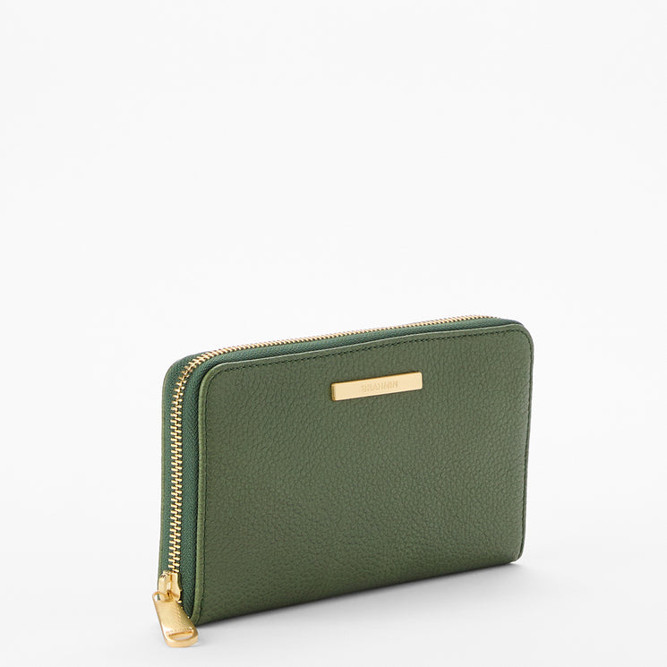 Brahmin green leather zippered wallet with gold-tone zipper and small gold nameplate on the front, displayed against a plain white background. Rectangular silhouette, smooth texture, and classic design.