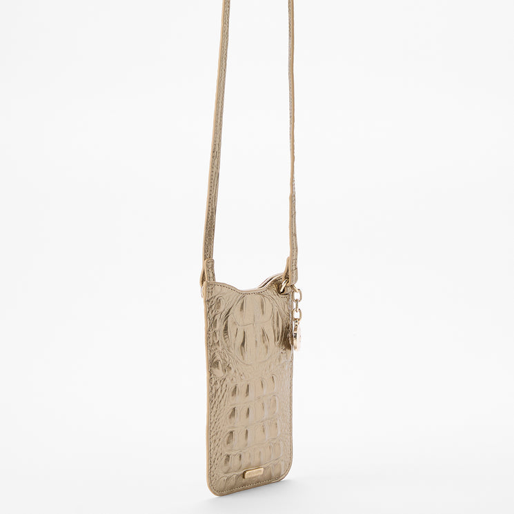 Brahmin Eris crossbody phone pouch in beige with crocodile-embossed texture, gold hardware, adjustable strap, slip top opening, and upright silhouette. Shown on a white background.