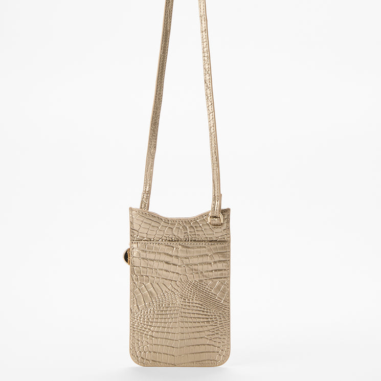 BRAHMIN Eris slim rectangular crossbody phone pouch in beige with an embossed crocodile-inspired pattern, slip top opening, long adjustable strap, front zip pocket, and upright view on a plain white background.