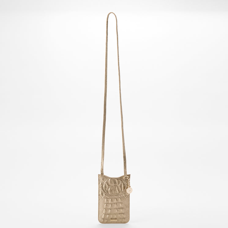 BRAHMIN Eris tan embossed leather crossbody phone pouch with long adjustable strap, round flap with gold hardware charm, slip top opening, and textured finish, shown on a plain white background.